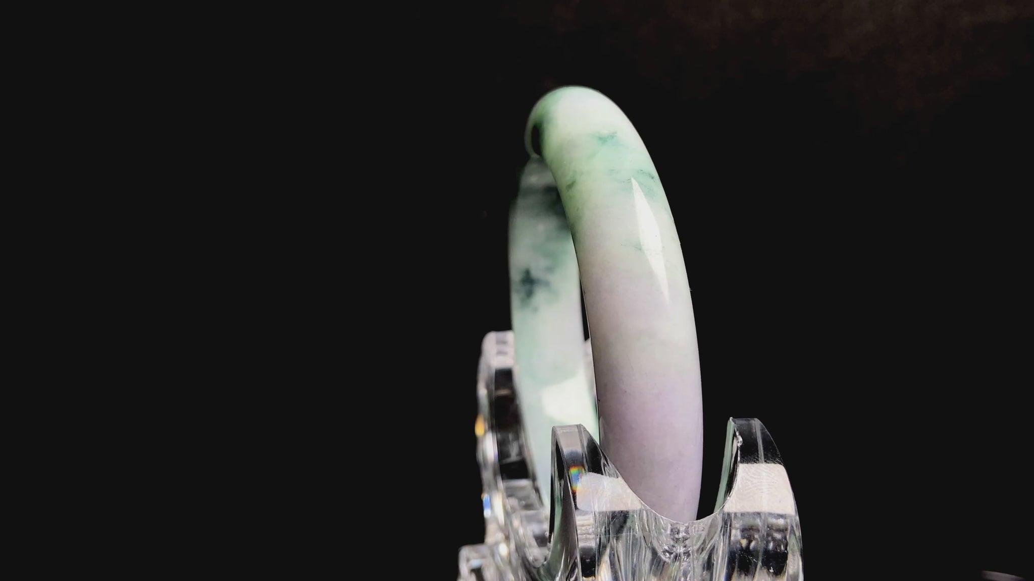 A misty green lavender jadeite bangle.