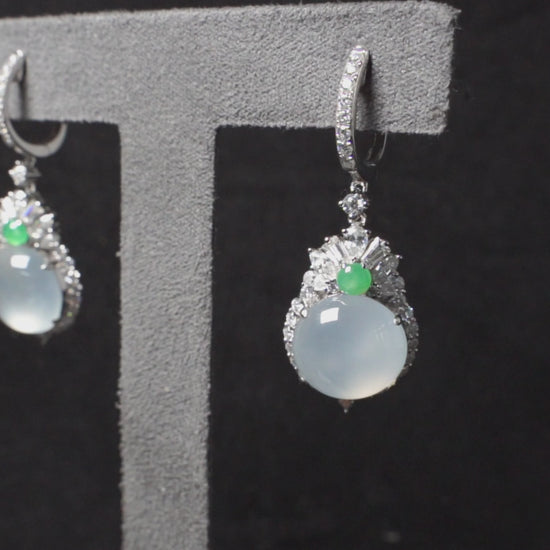 Icy moon drop green accent jadeite earrings.