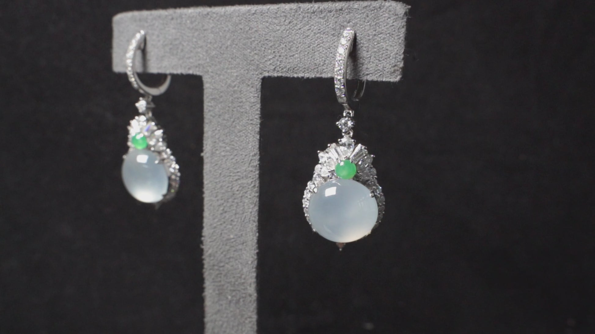Icy moon drop green accent jadeite earrings.
