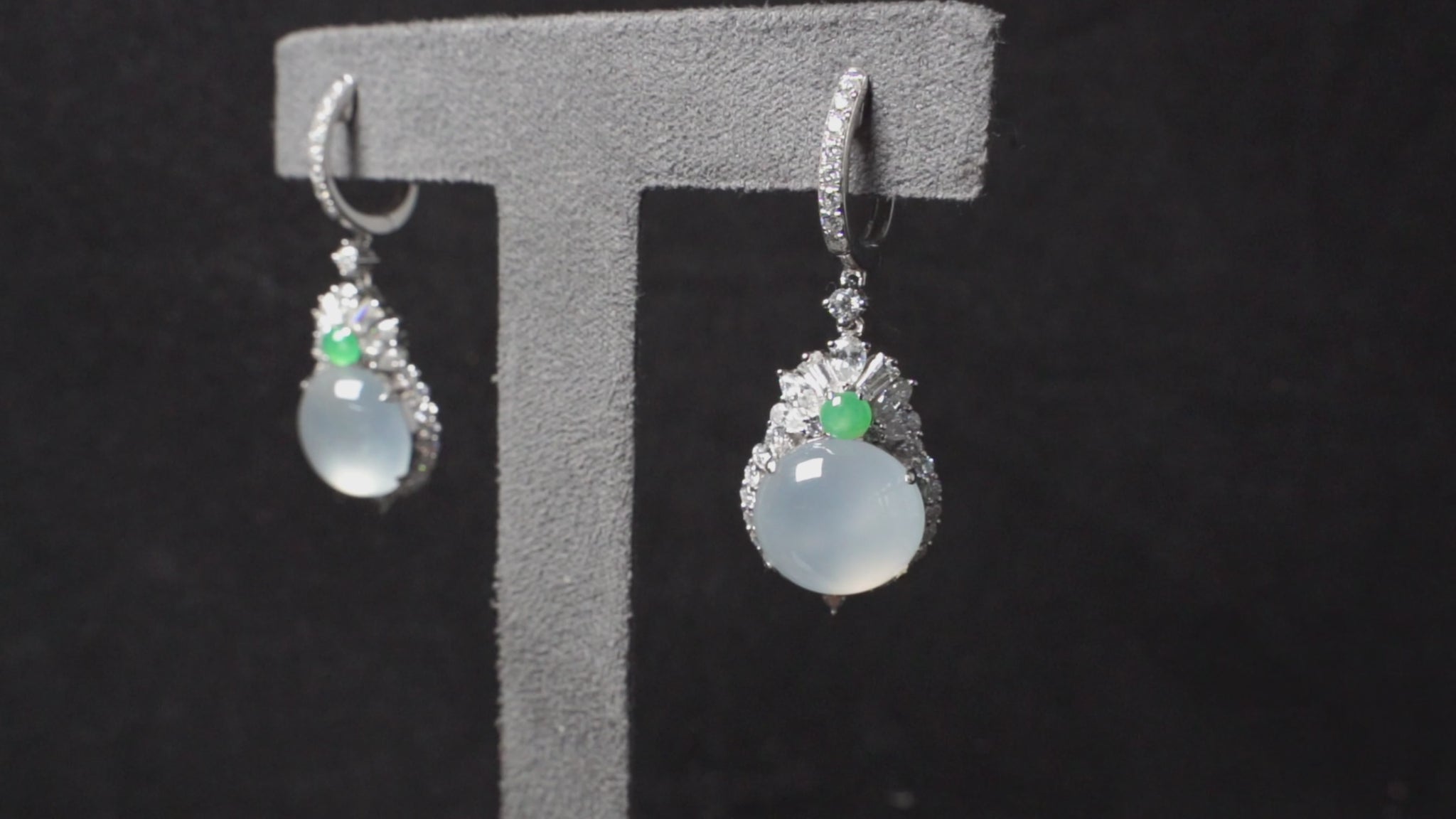 Icy moon drop green accent jadeite earrings.