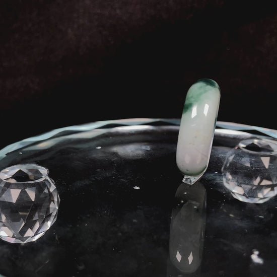 A swirling green ink veil jadeite ring.