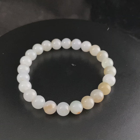 A milky golden hue jadeite beads bracelet.