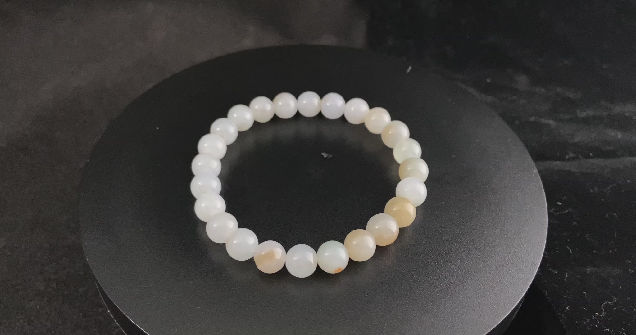 A milky golden hue jadeite beads bracelet.