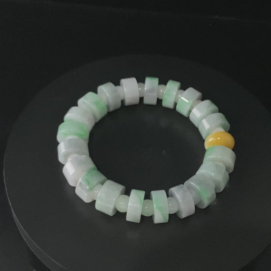 A cylinder mint yellow slice jadeite beads bracelet.
