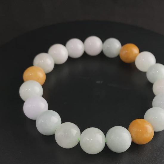 A four hues harmony jadeite beads bracelet.