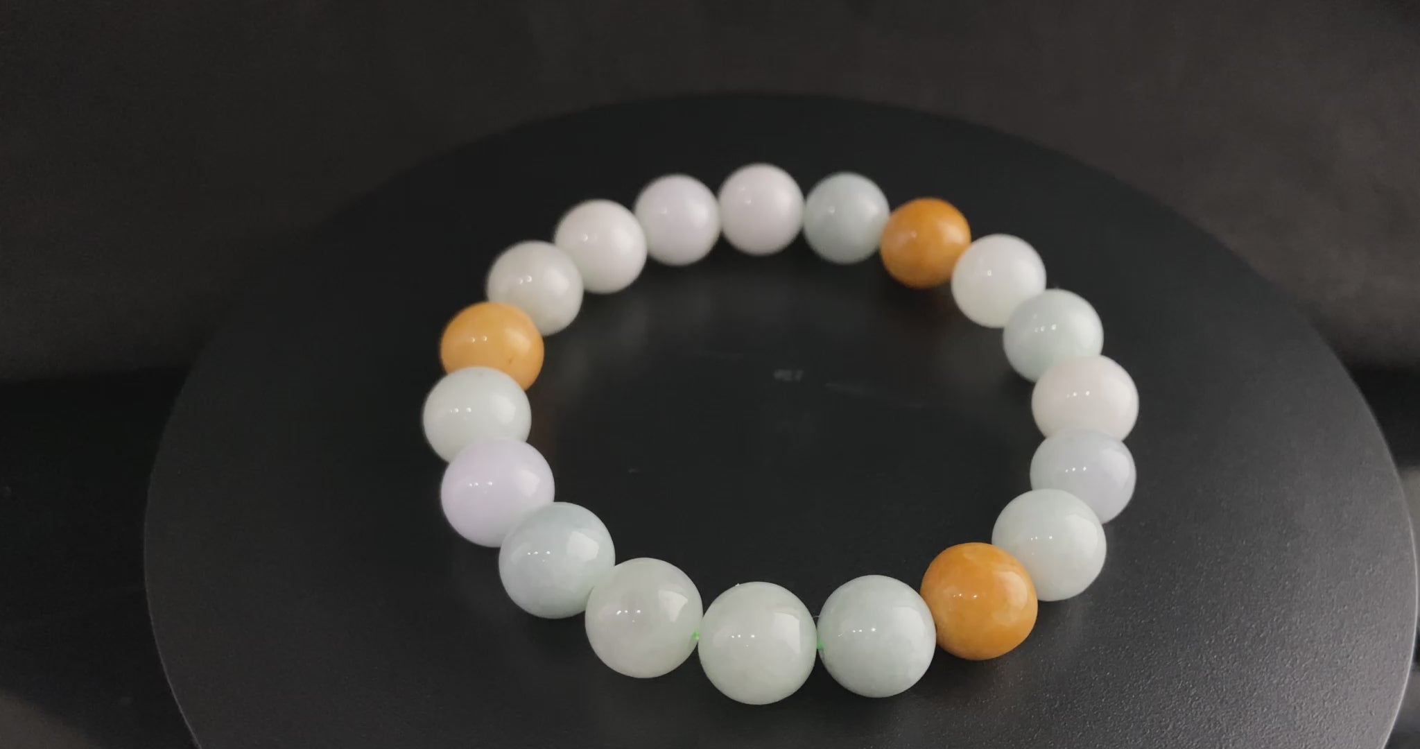 A four hues harmony jadeite beads bracelet.