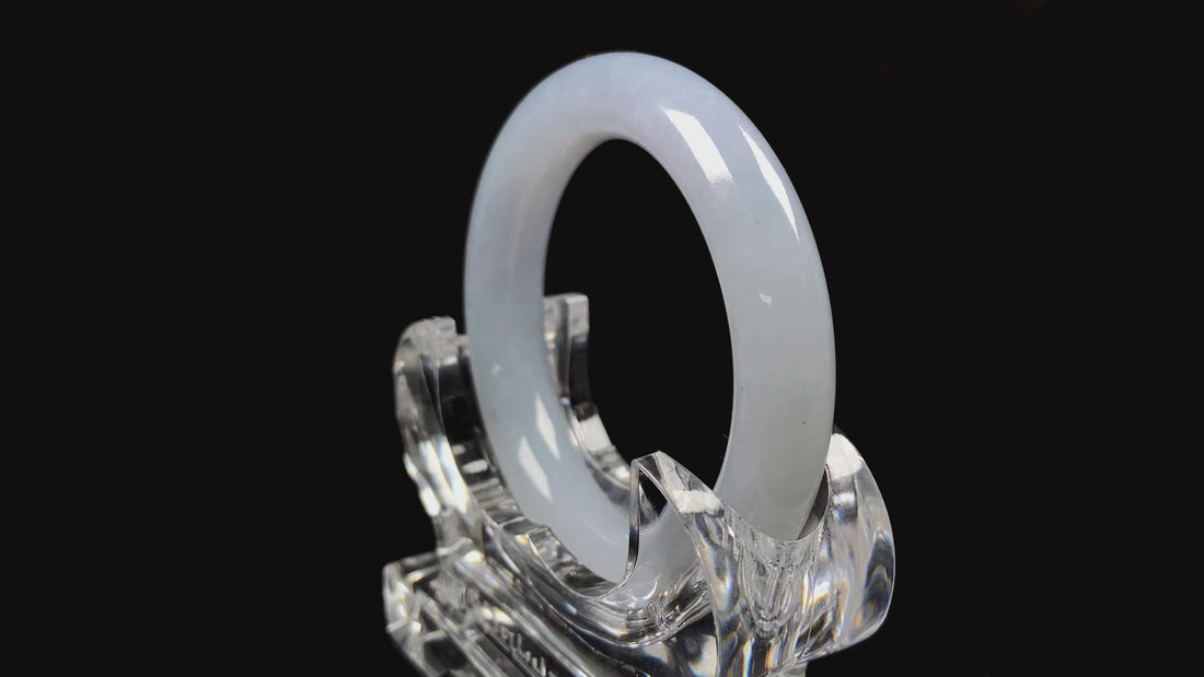 A moonlit white with pale blue jadeite bangle.