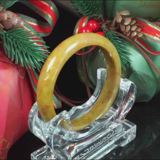  A auburn tinged golden caramel jadeite bangle.