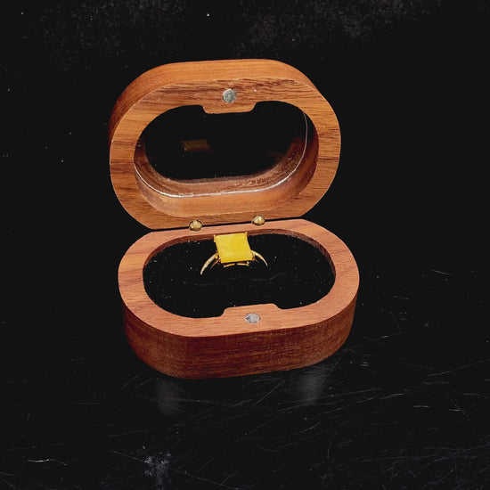 A rich yellow square jadeite ring.