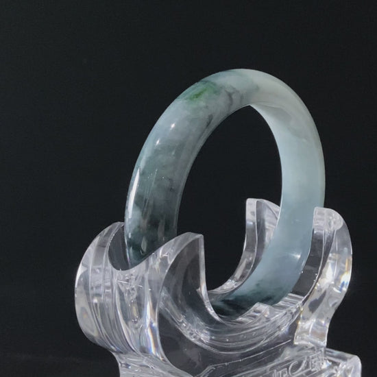 A blue dusk radiance jadeite bangle.