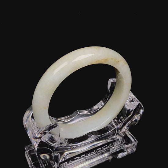 Golden shimmers sprinkling lightly jadeite bangle.