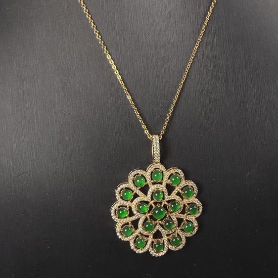 A filigree verdant cluster jadeite pendant.