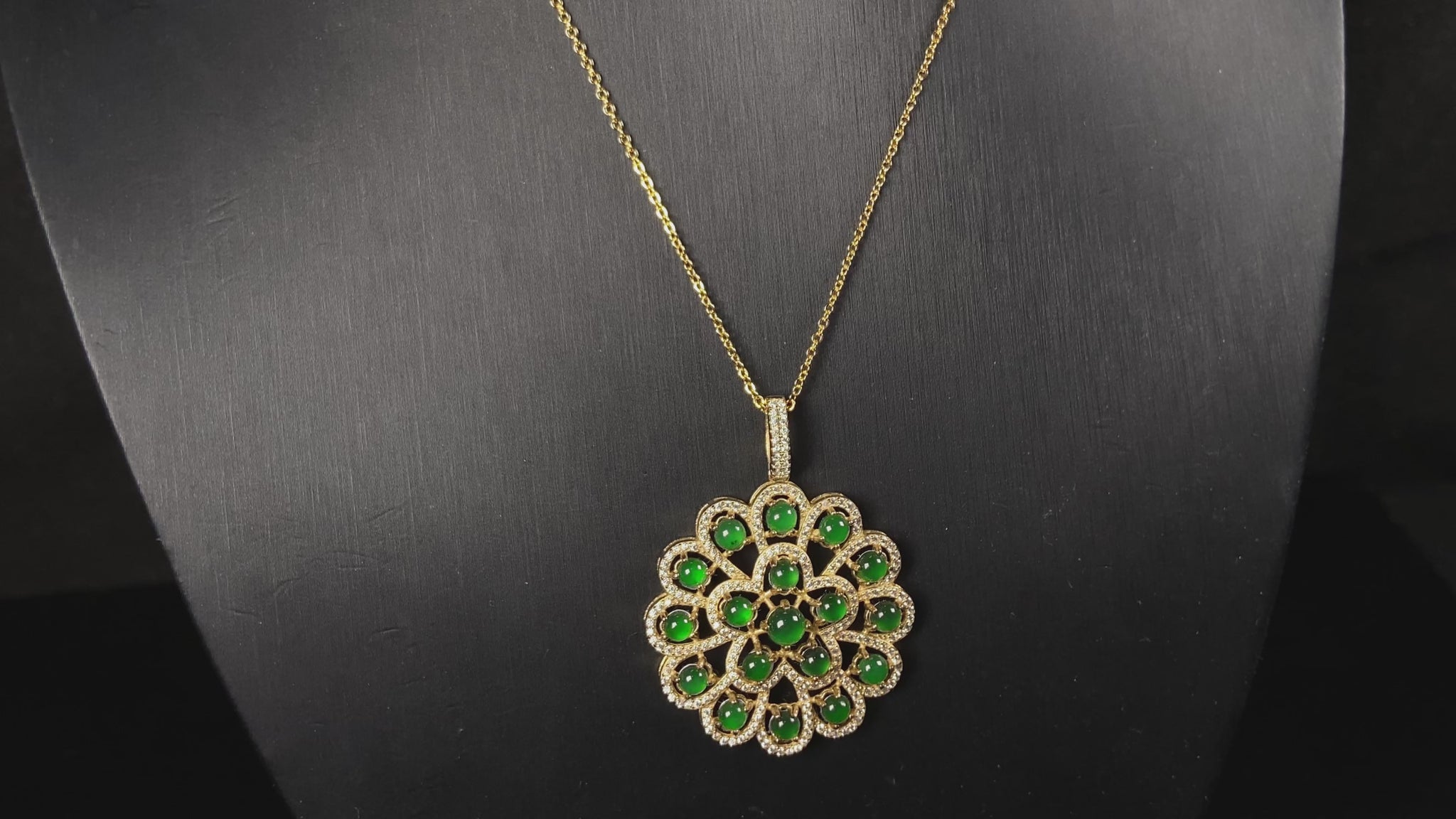 A filigree verdant cluster jadeite pendant.