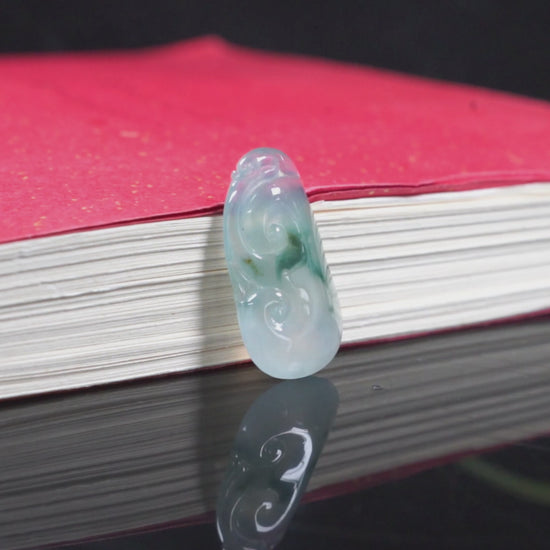 A icy translucent moss infused Ruyi loose jadeite.