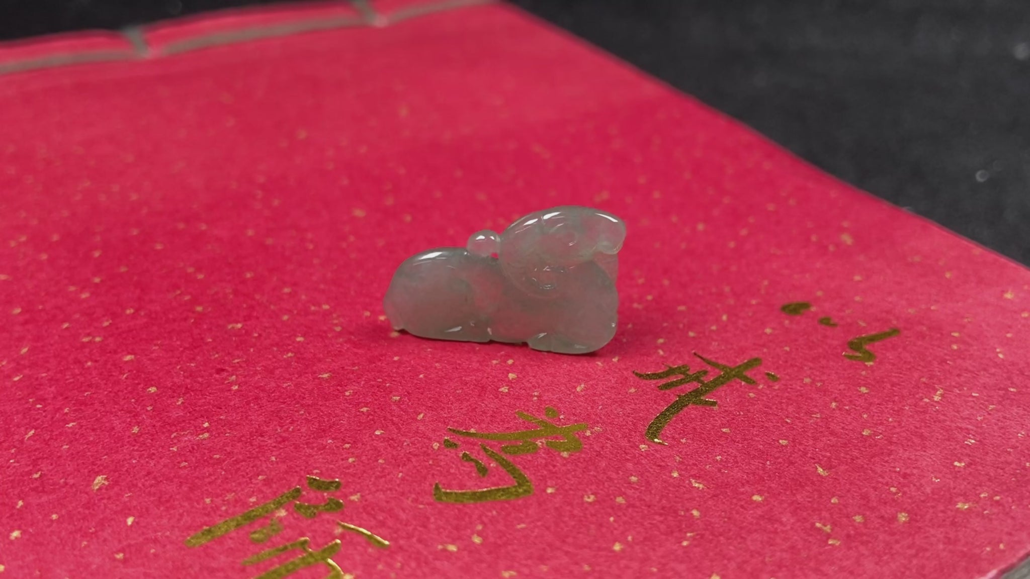 A lustrous pale green sheep loose jadeite.