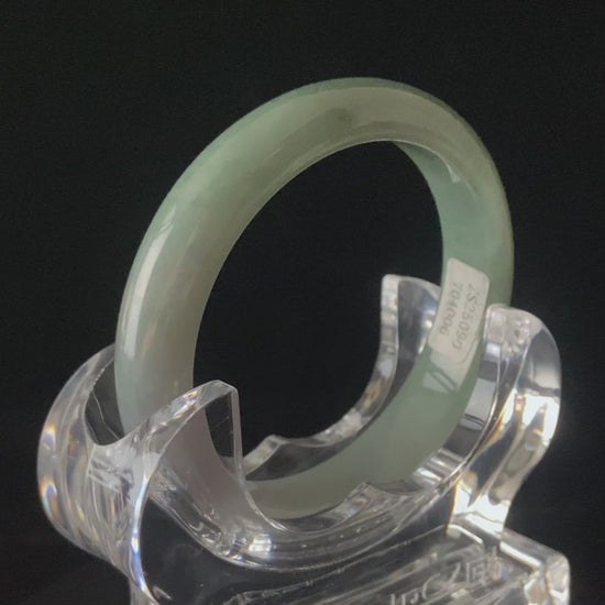 A willow green white veil jadeite bangle.