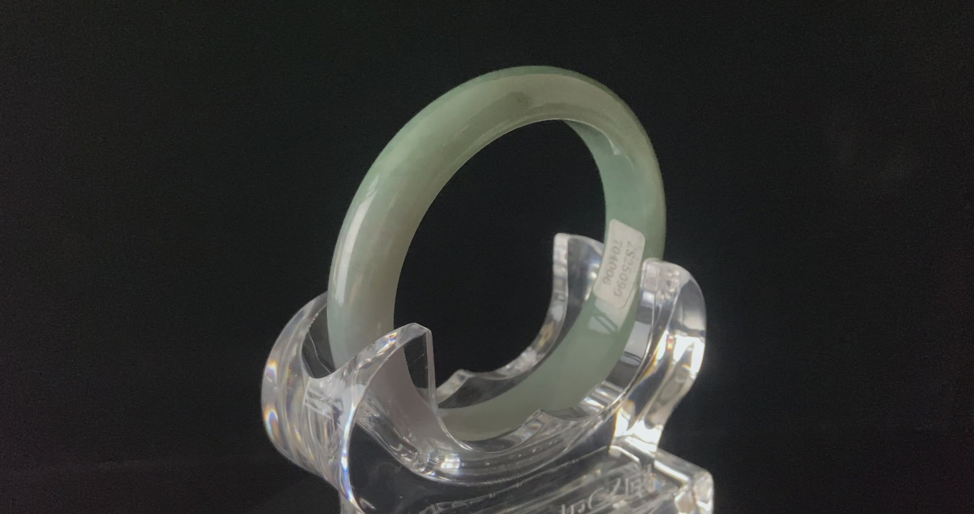 A willow green white veil jadeite bangle.
