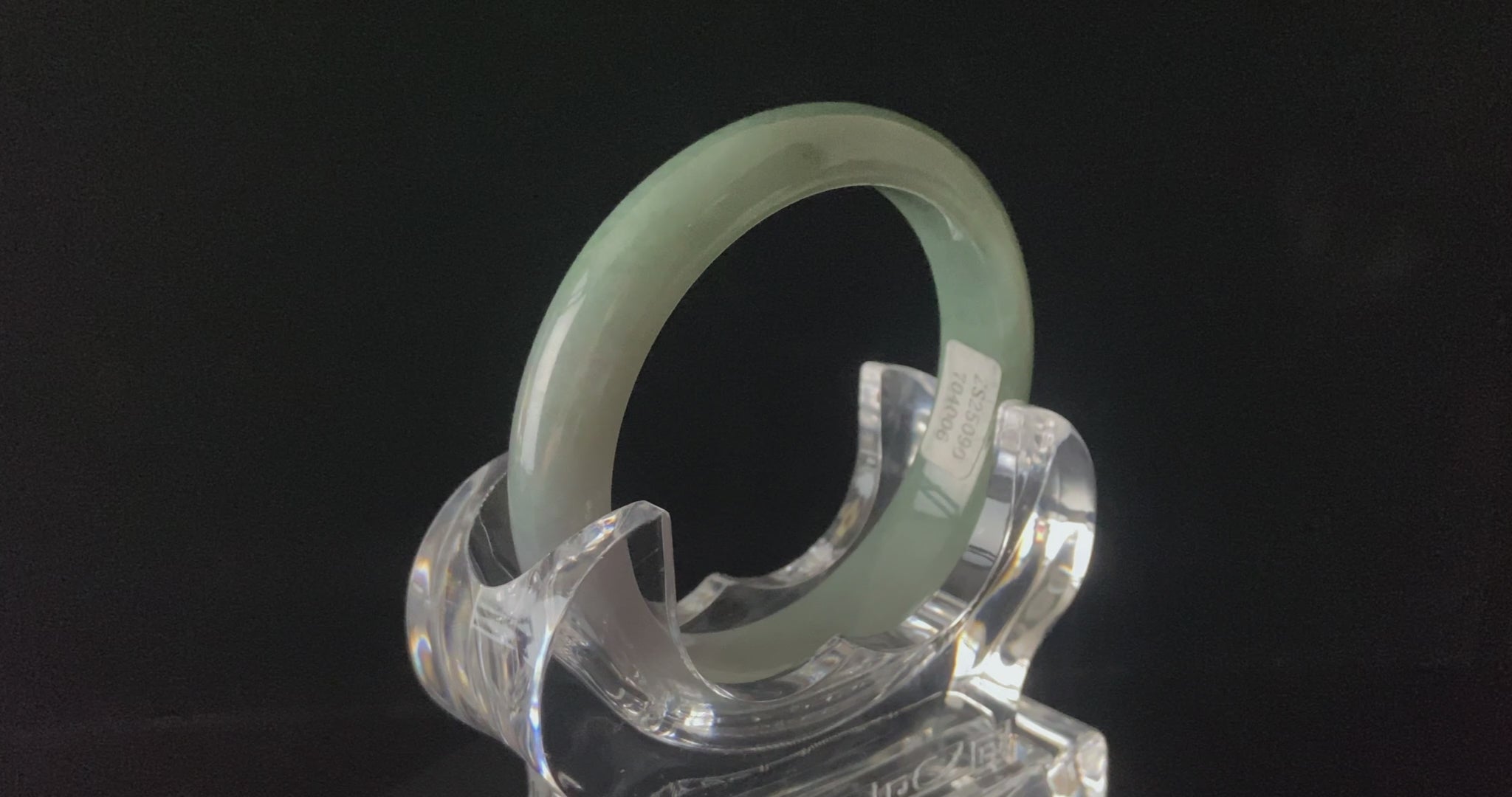 A willow green white veil jadeite bangle.