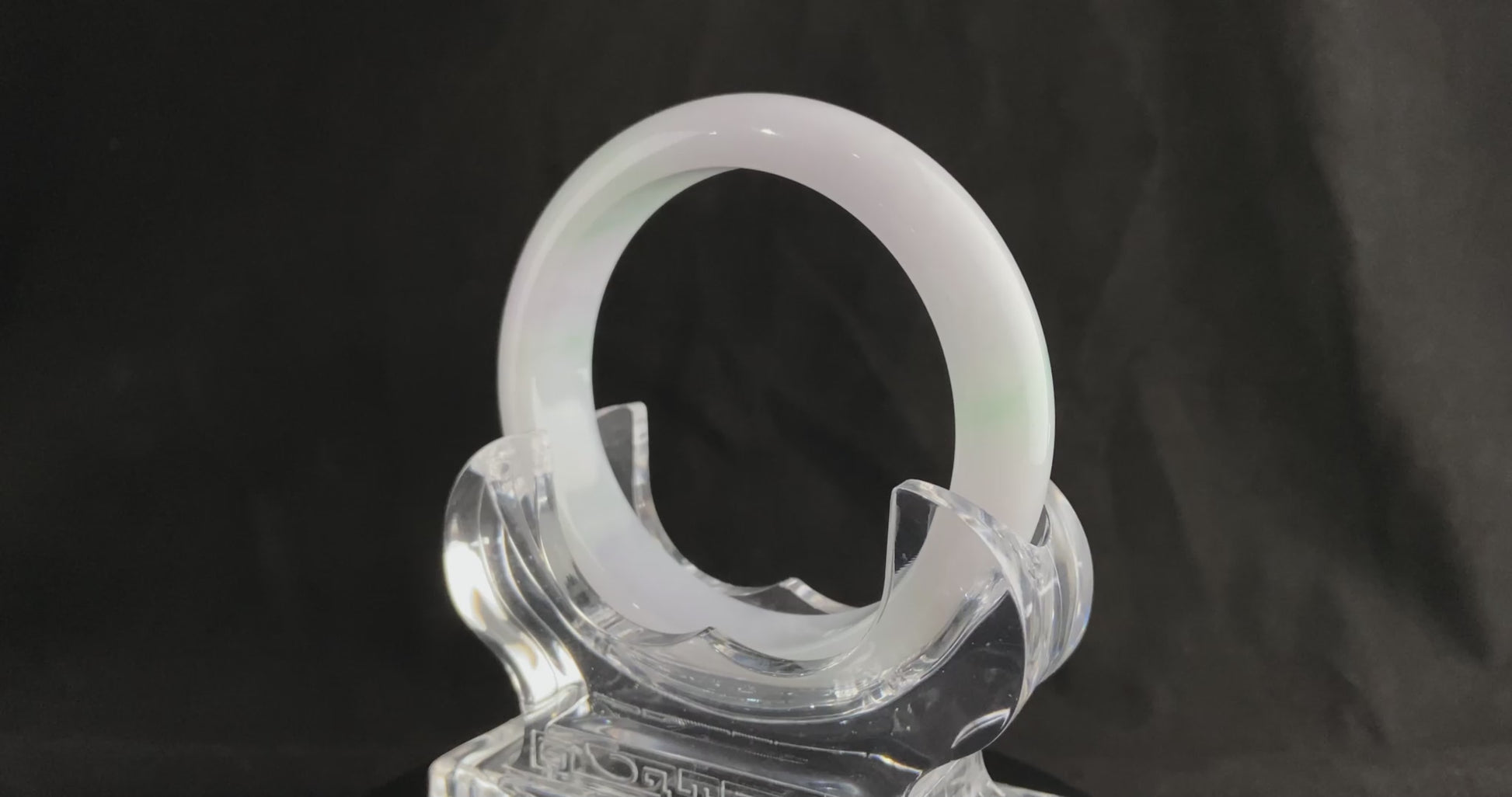 A pristine white with green veil jadeite bangle.