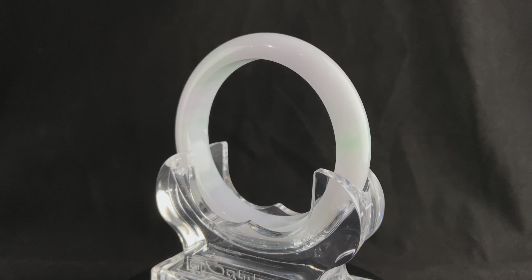 A pristine white with green veil jadeite bangle.