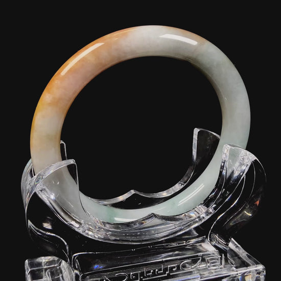 A sunset ice jadeite bangle.