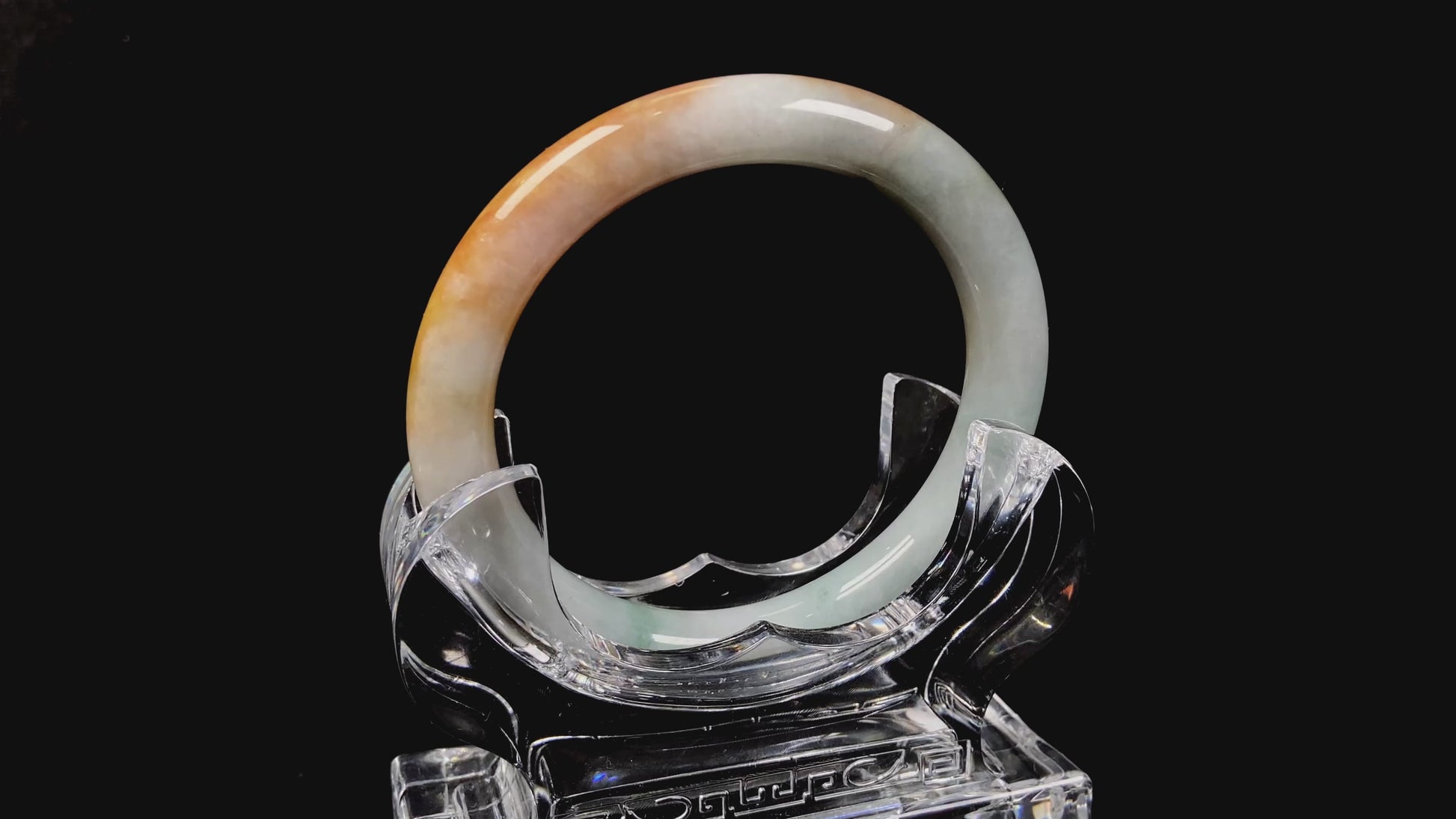 A sunset ice jadeite bangle.