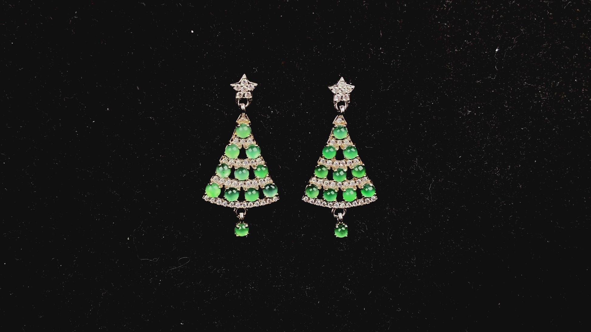 A pair of lucky green christmas tree jadeite earrings.