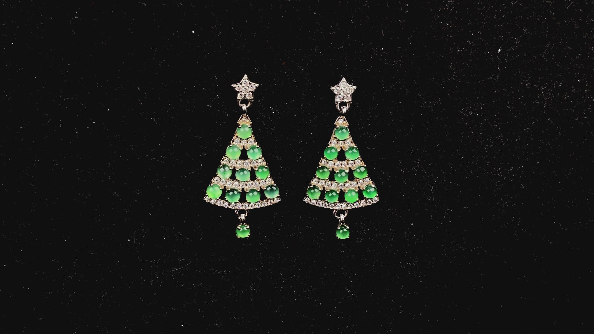 A pair of lucky green christmas tree jadeite earrings.