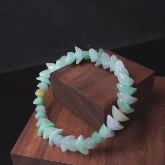 A multi-color Yuanbao-shaped jadeite beads bracelet.