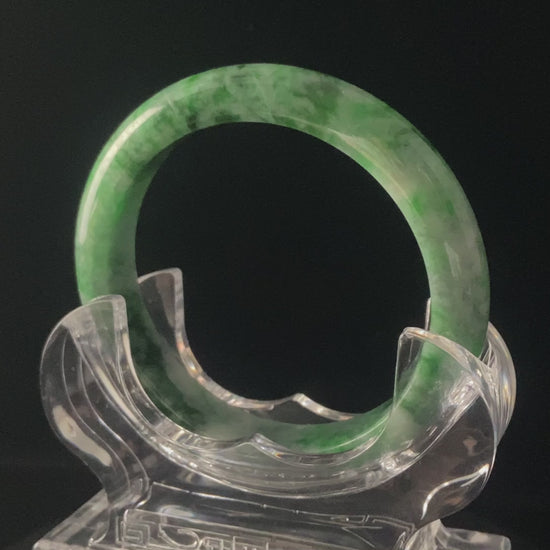 A mossy forest veil jadeite bangle.