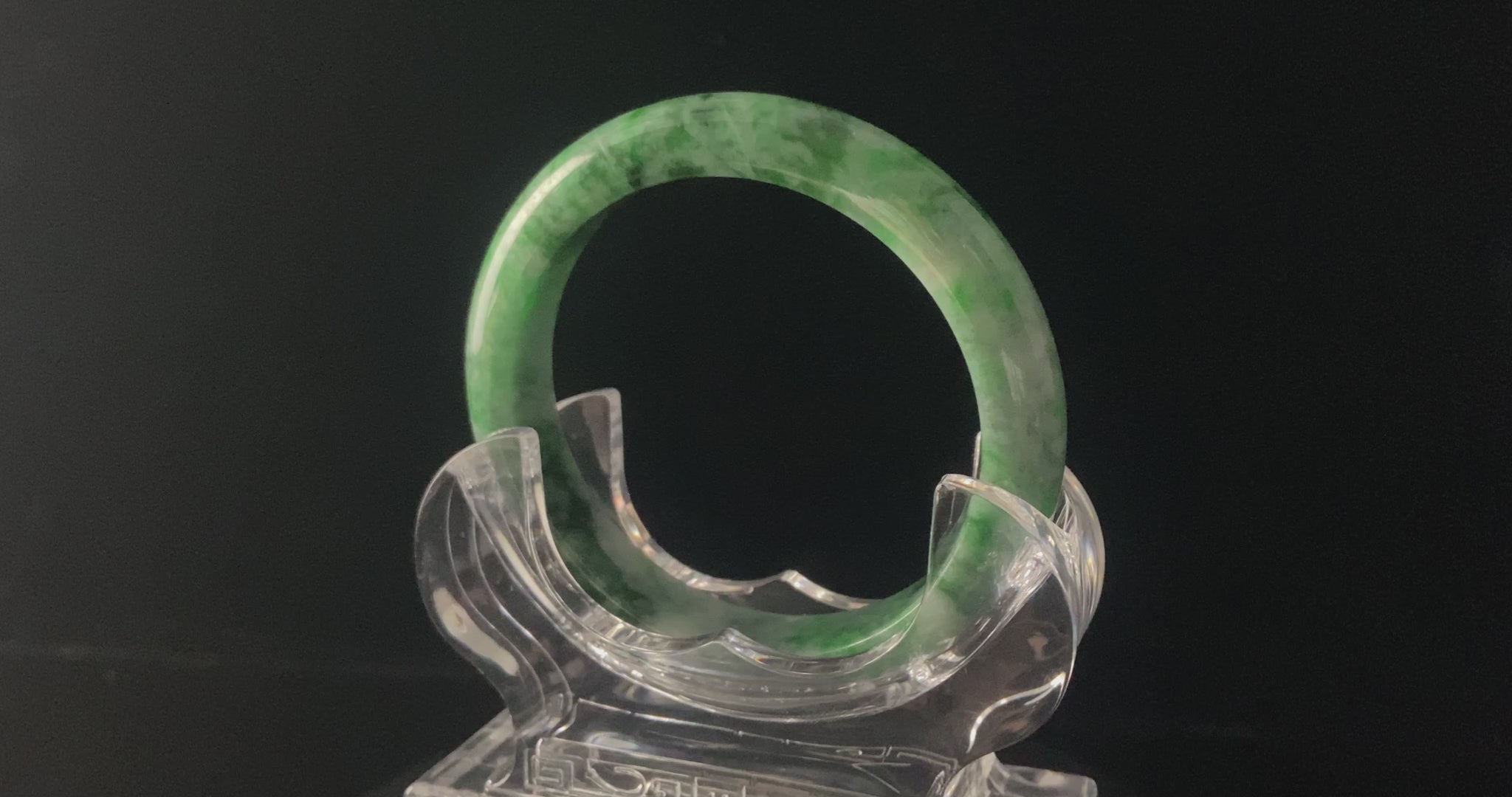 A mossy forest veil jadeite bangle.