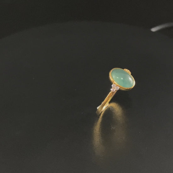 A lagoon blue-green jadeite ring.