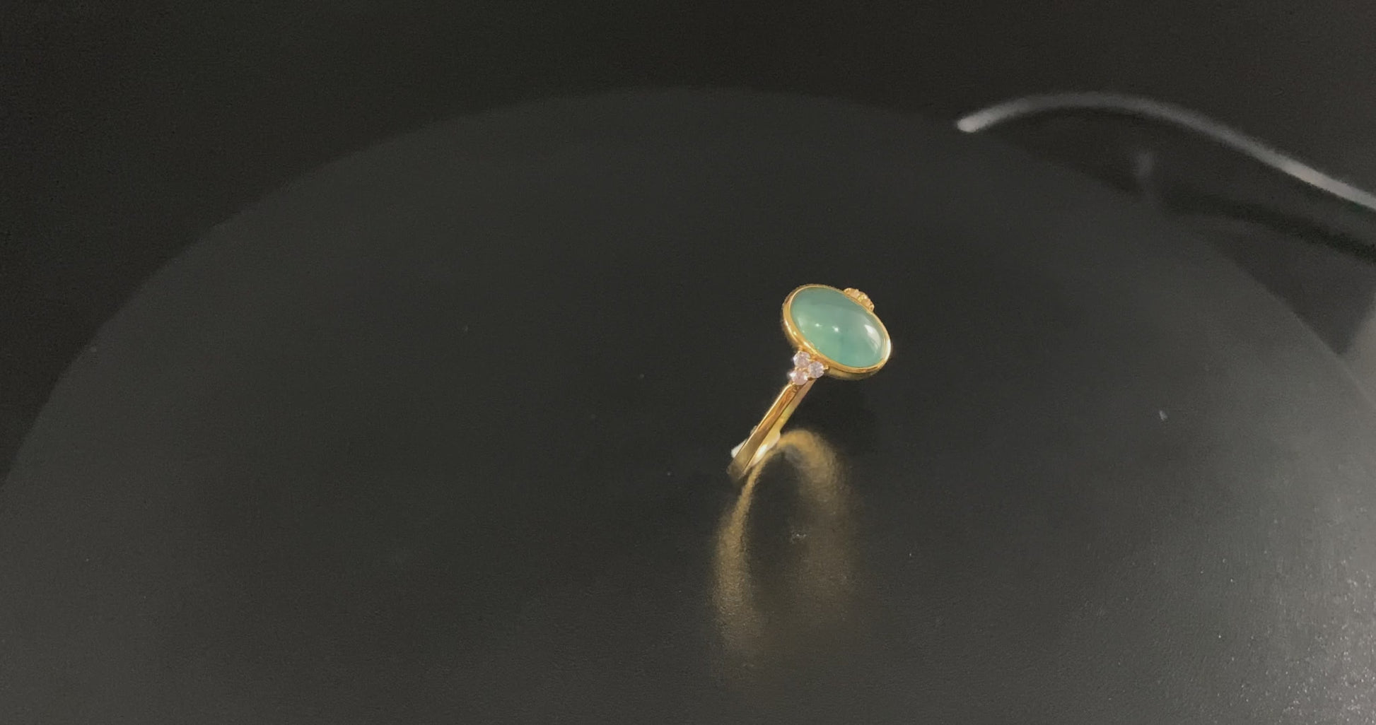A lagoon blue-green jadeite ring.