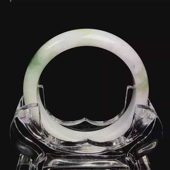 A pearl moss drift jadeite bangle.