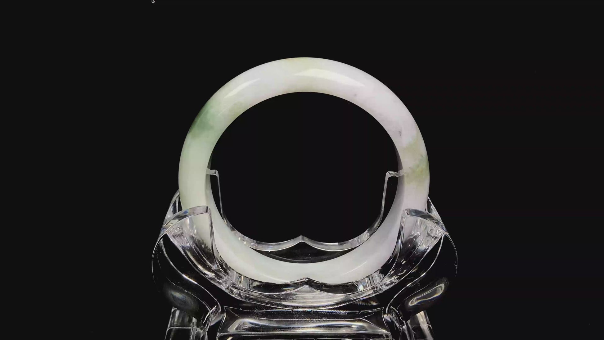 A pearl moss drift jadeite bangle.