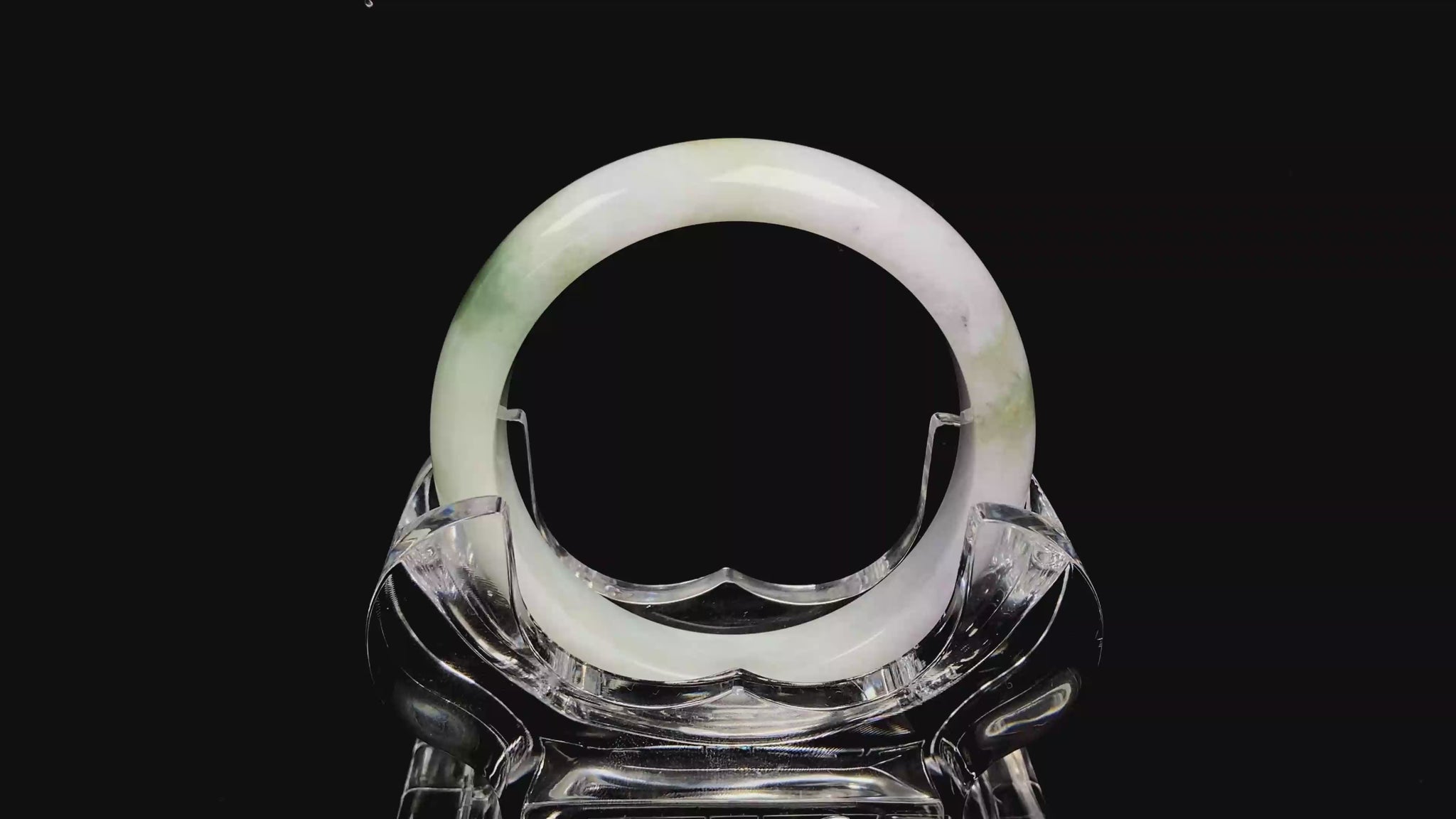 A pearl moss drift jadeite bangle.