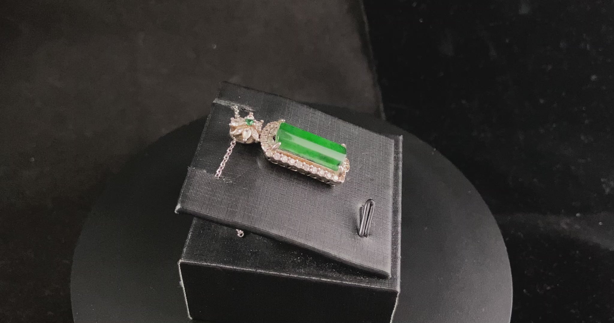 A rich green star frame jadeite pendant.