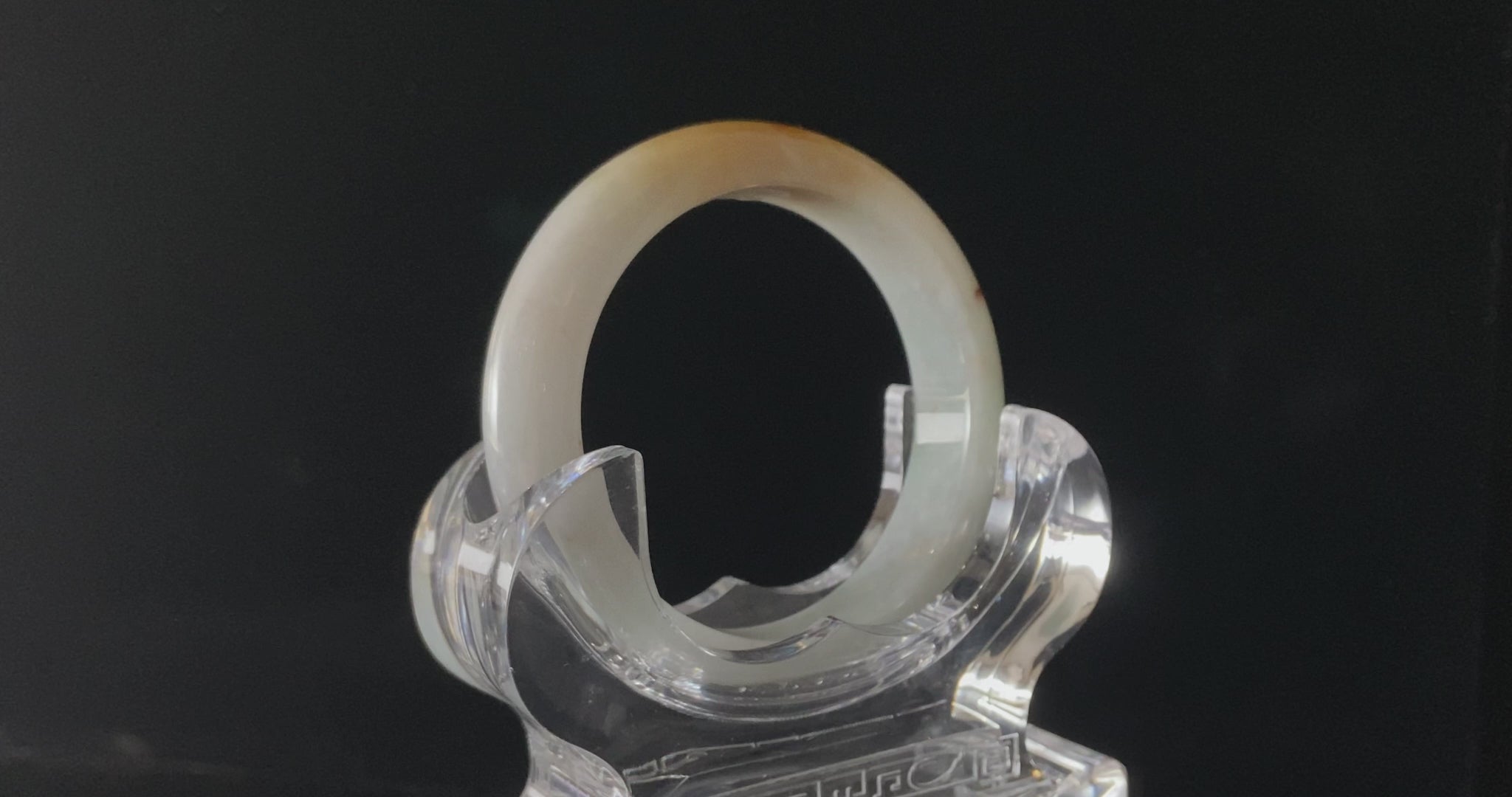 A creamy sunlit veil jadeite bangle.