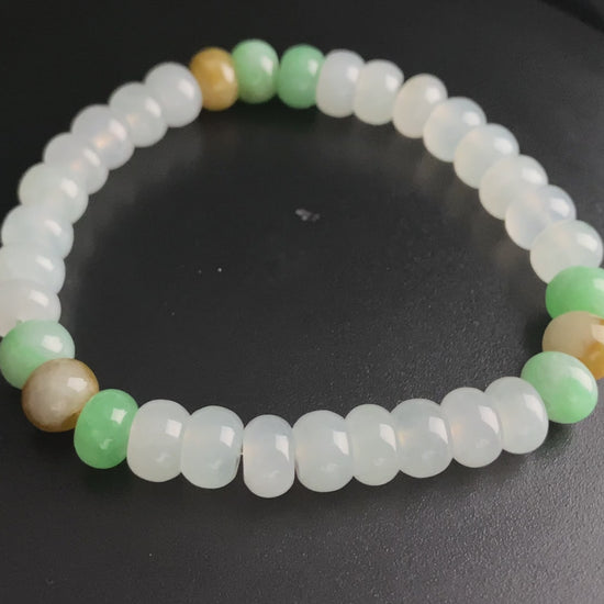 A golden green white blessing jadeite beads bracelet.