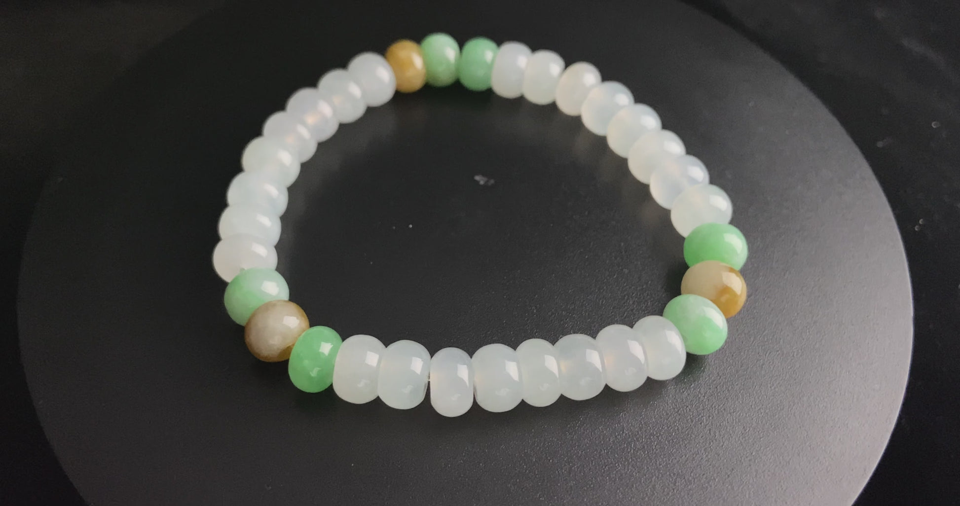 A golden green white blessing jadeite beads bracelet.