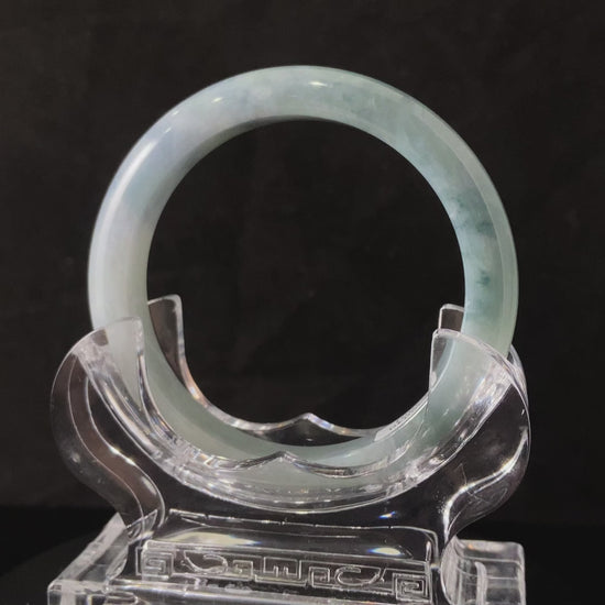A sky blue cloud jadeite bangle.