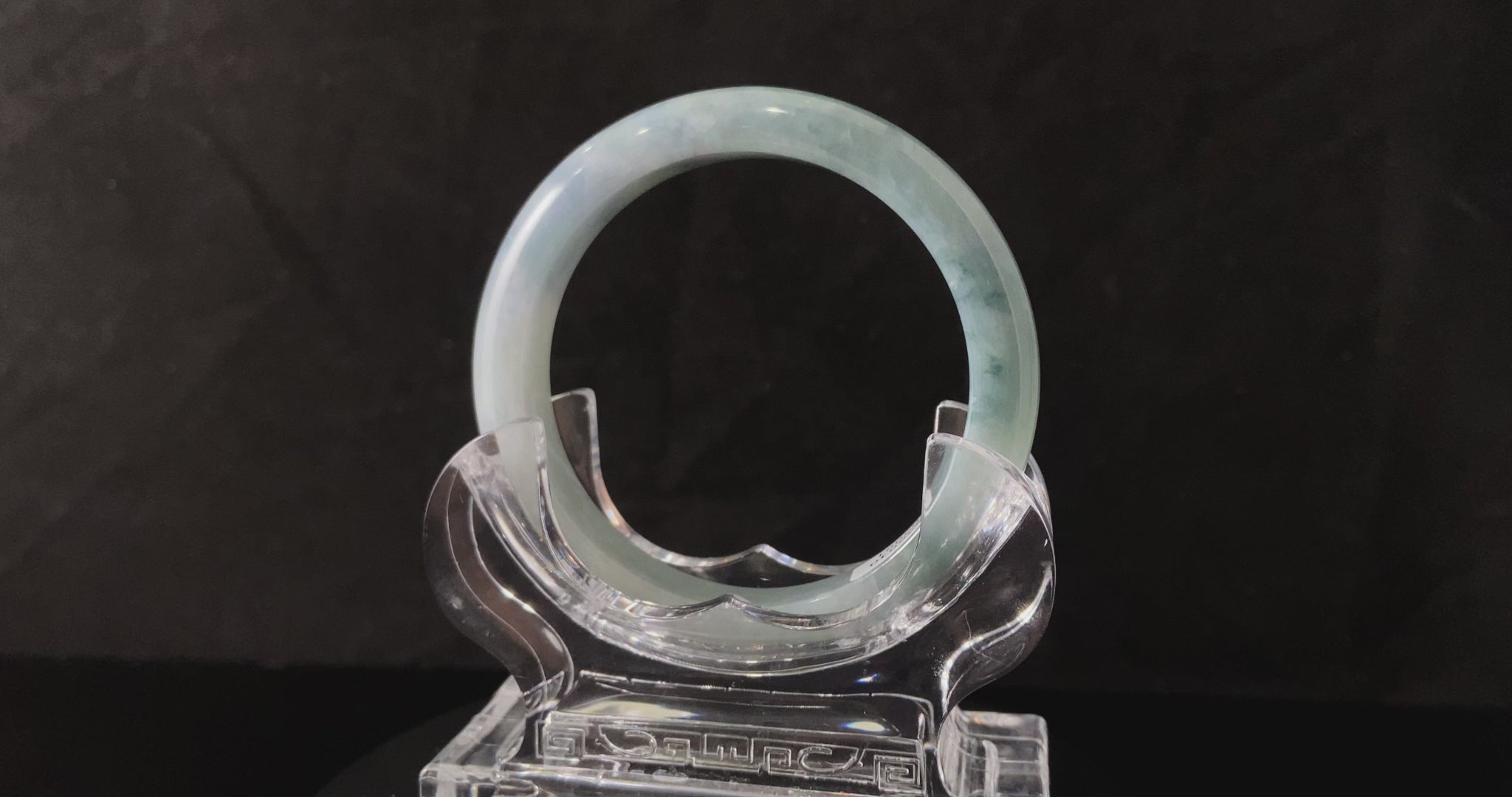 A sky blue cloud jadeite bangle.