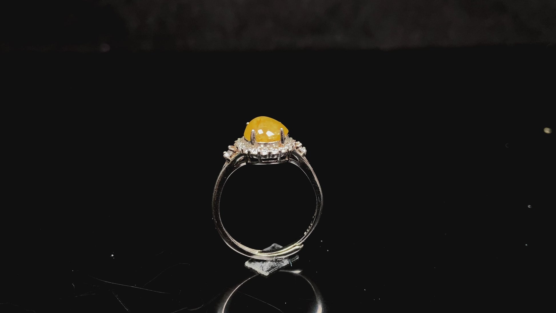 A apricot-hued jadeite bangle.
