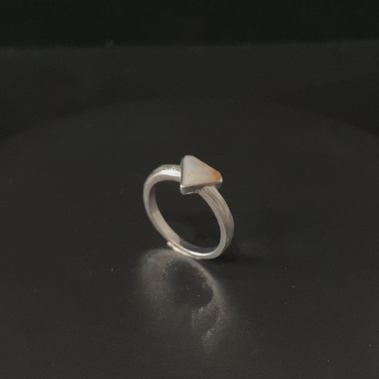 A sunset sugar triangle jadeite ring.