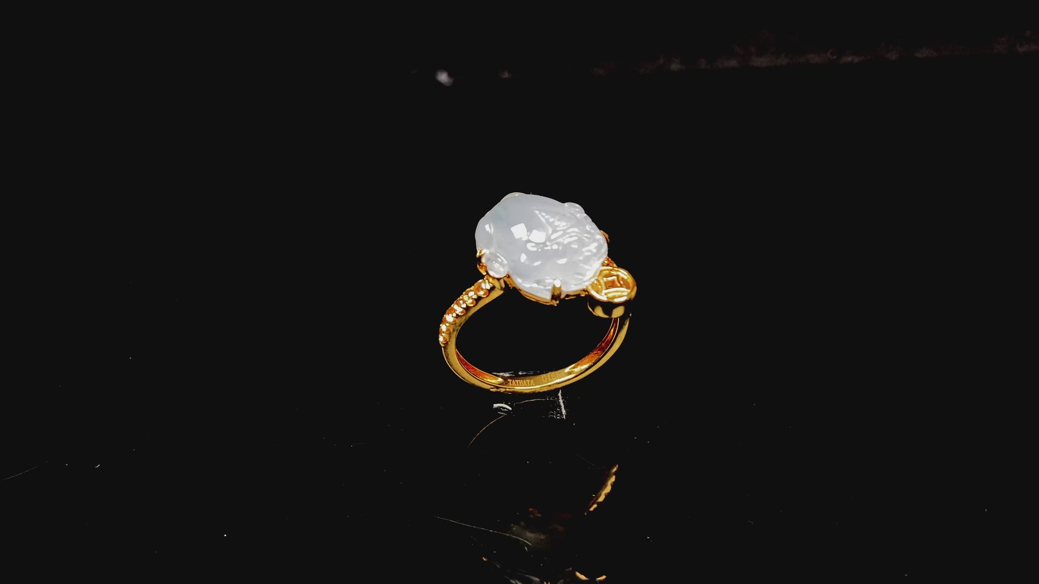A icy white fortune Pixiu jadeite ring.