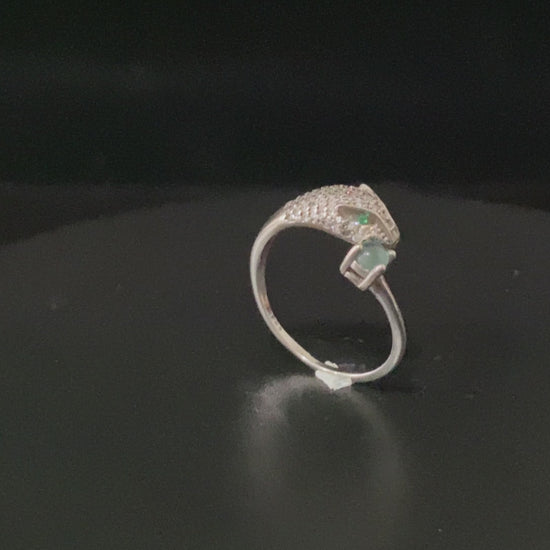 A silver serpent bite jadeite ring.