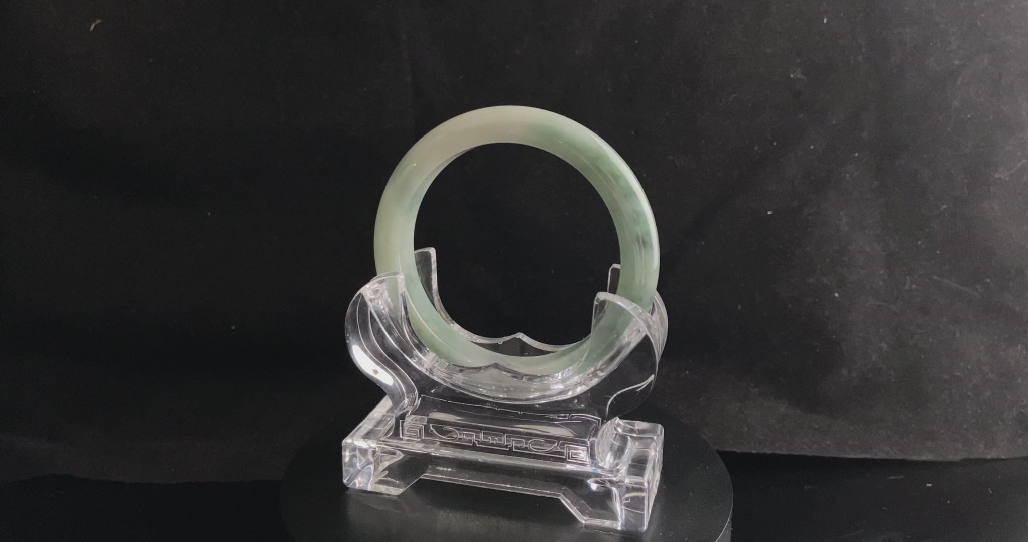 A milky white with faint green jadeite bangle.