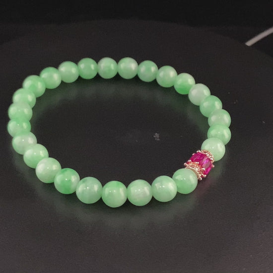 A pale mint and pink spark jadeite beads bracelet.