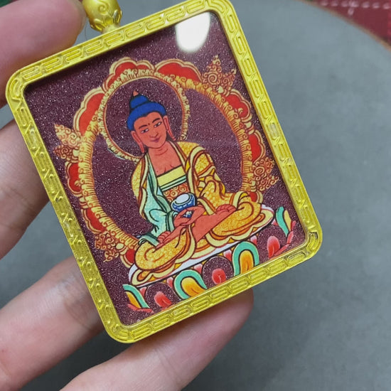 Golden Gawu box with a Thangka of Amitabha Buddha inside.