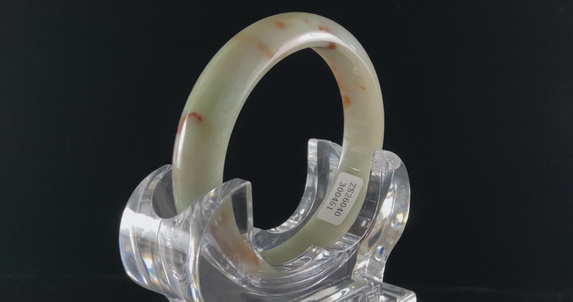A moss coral calm jadeite bangle.